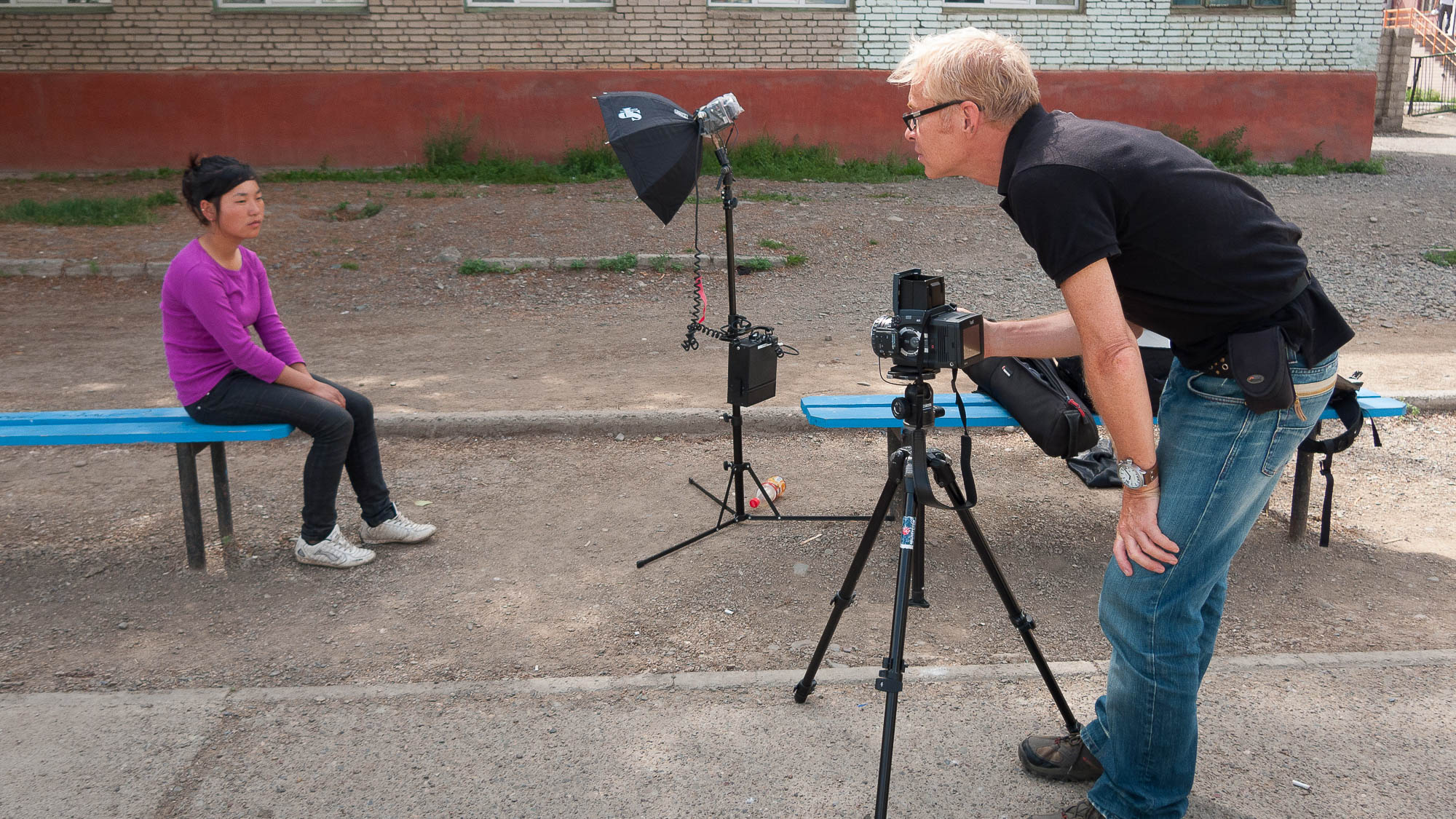 Making a portrait of street girl in Ulaanbaatar